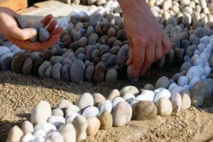 Blott Kerr-Wilson, 'Ballymaloe', artist laying stones