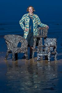Blott Kerr-Wilson, 'Chairs', the artist photographed with two mussel shell chairs