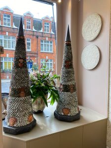 Shell cone works in the window of Jet & Co London