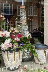 Shelled pots in the window of Jet and Co
